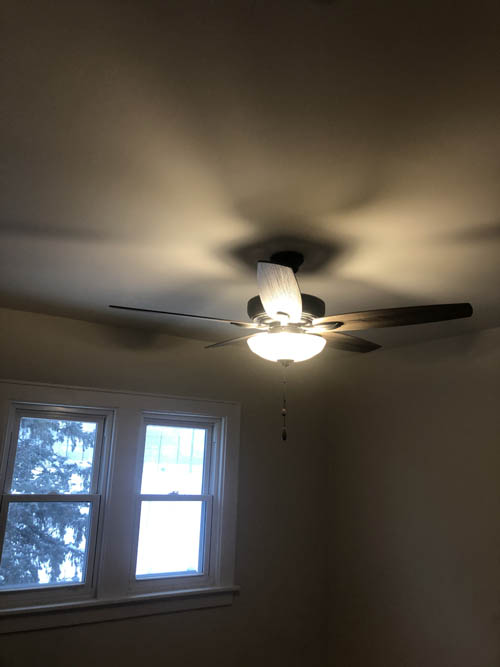 light fixture and ceiling fan in home